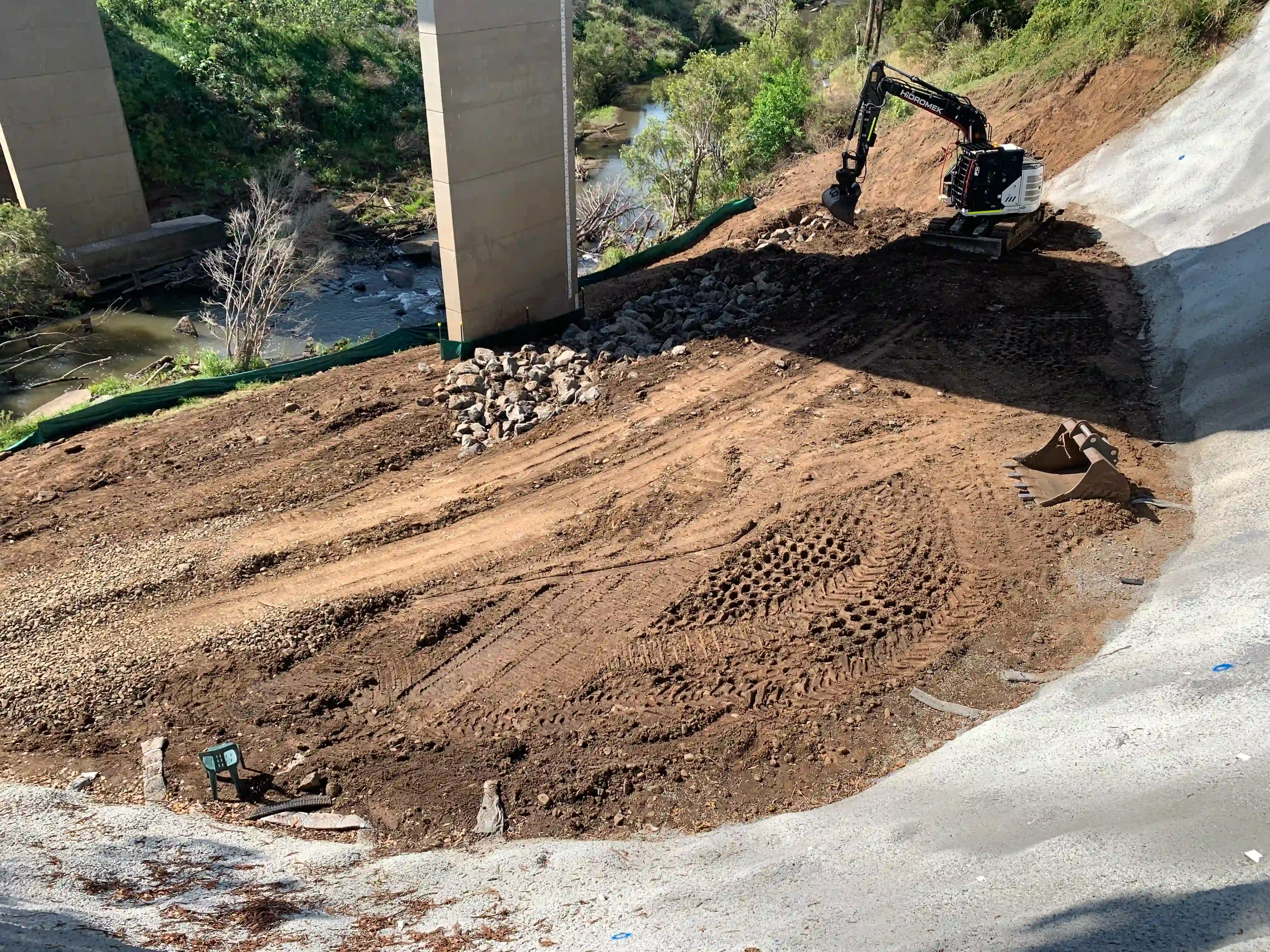 Machinery working on earthworks for the Geneva Bridge Landslide Remediation in Kyogle, NSW