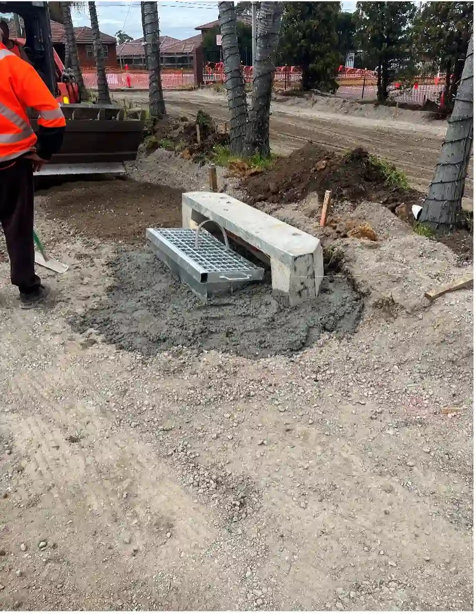 Workers Laying a Drain for the McCredie Hotel Carpark in Guilford, NSW