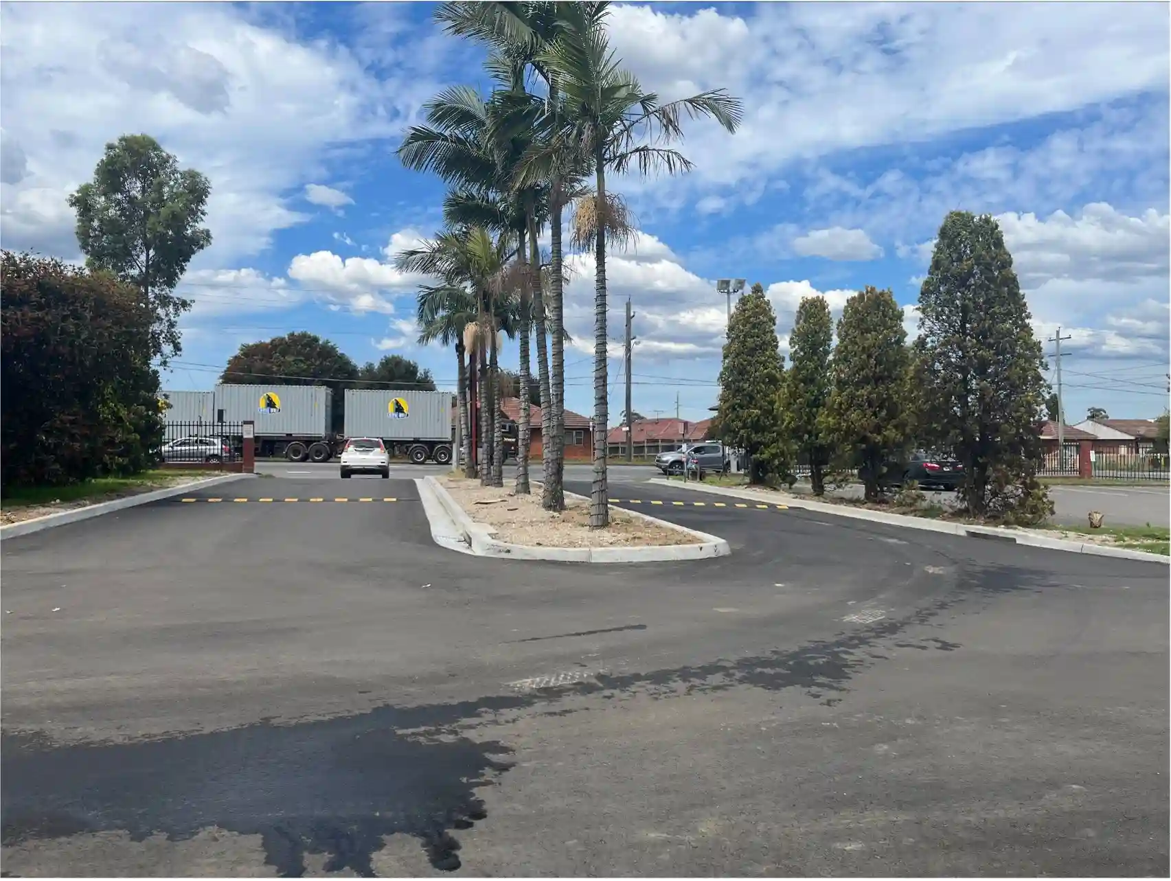 Finished View of the McCredie Hotel Carpark with white gutters, surrounded by trees, in Guilford, NSW