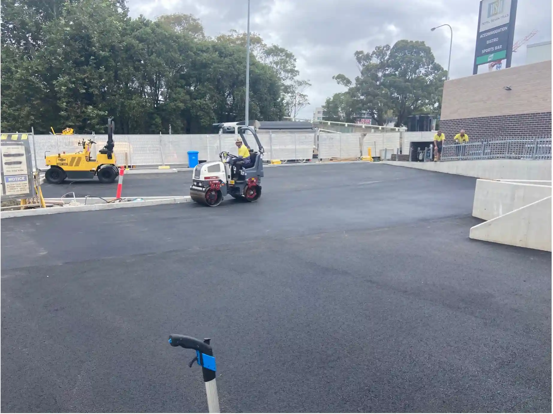 A roller compacting the McCredie Hotel Carpark in Seven Hills, NSW