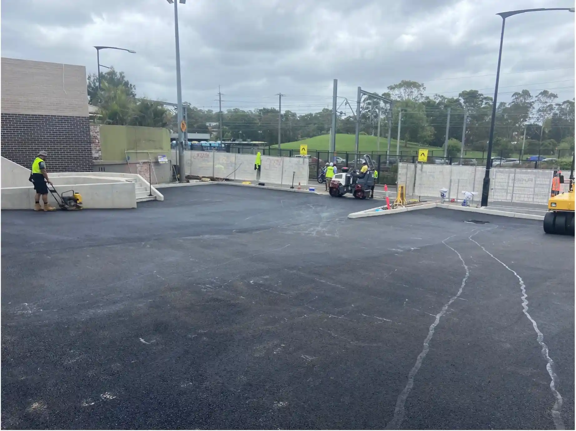 Workers developing the McCredie Hotel carpark in Seven Hills, NSW